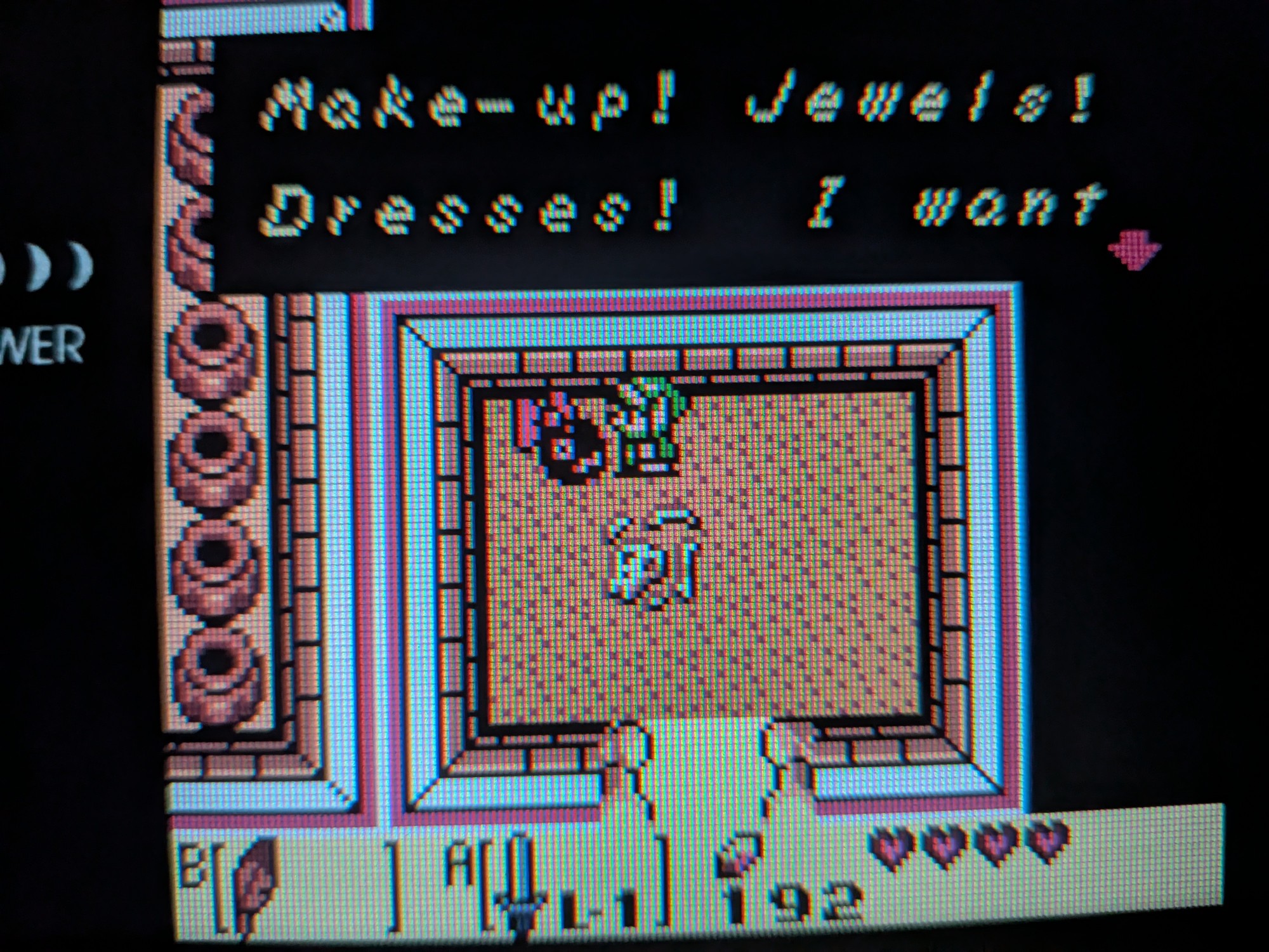 A picture of dialog from The Legend of Zelda Link's Awakening DX in which a small Chain Chomp with a pink bow says "Make-up! Jewels! Dresses! I want..."